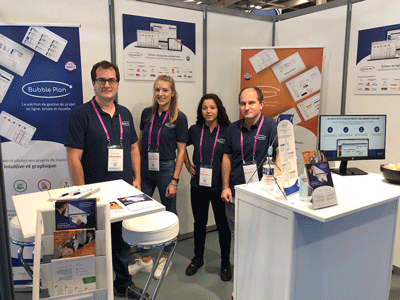 The team from French startup Bubble Plan, in the middle of the Digital Workplace exhibition